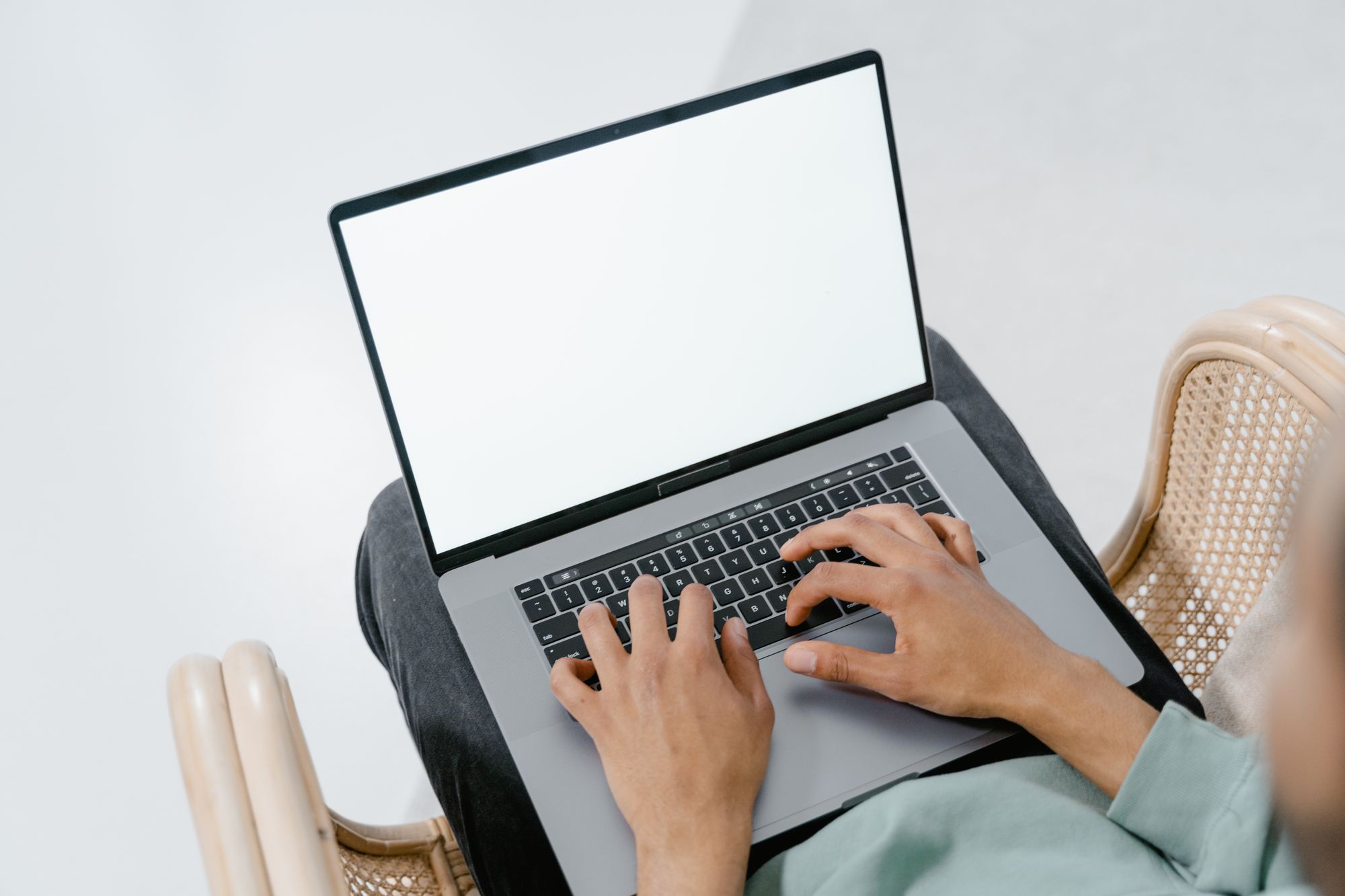 Working at a laptop in a relaxed office setting