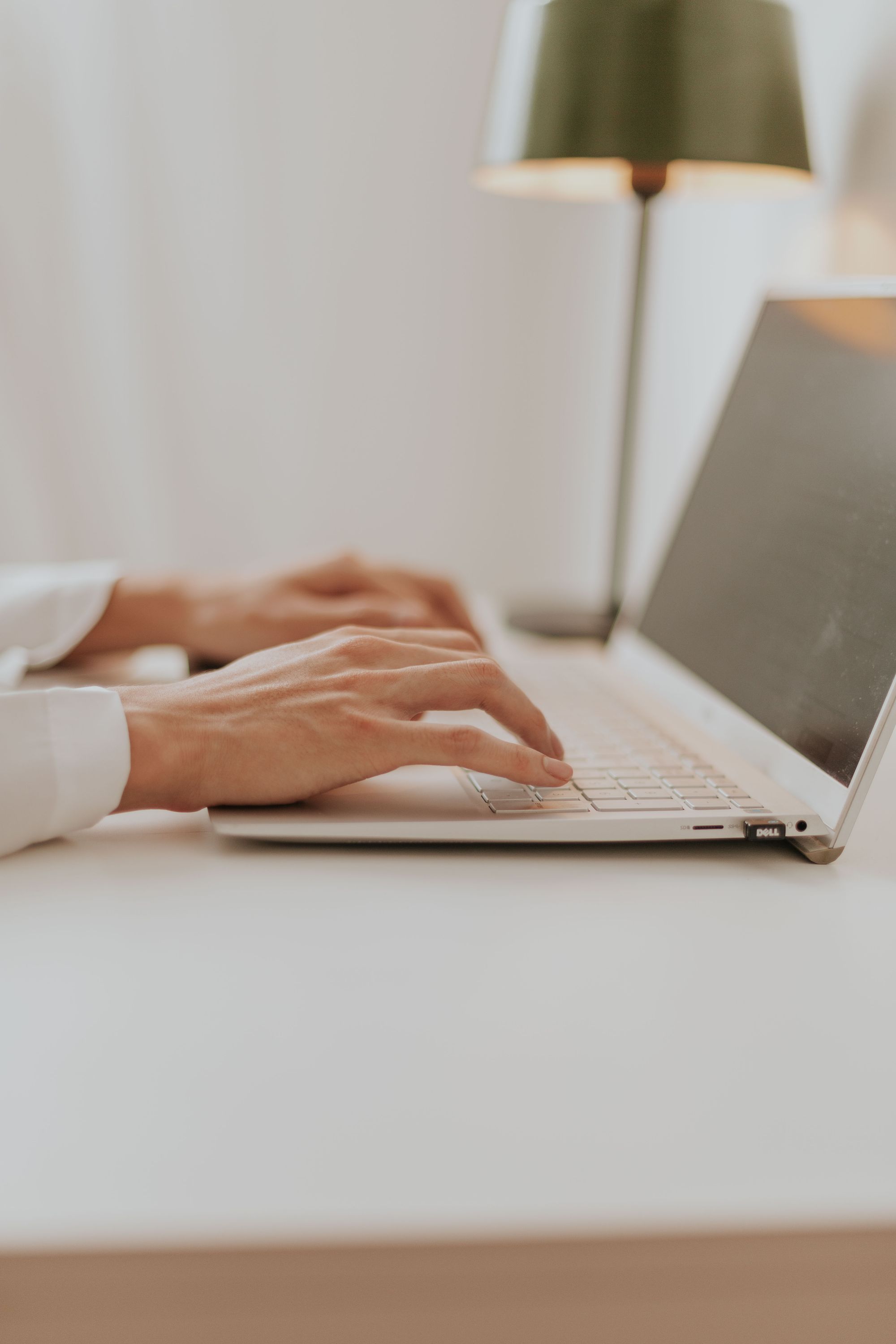 Working at a laptop in a quiet office setting