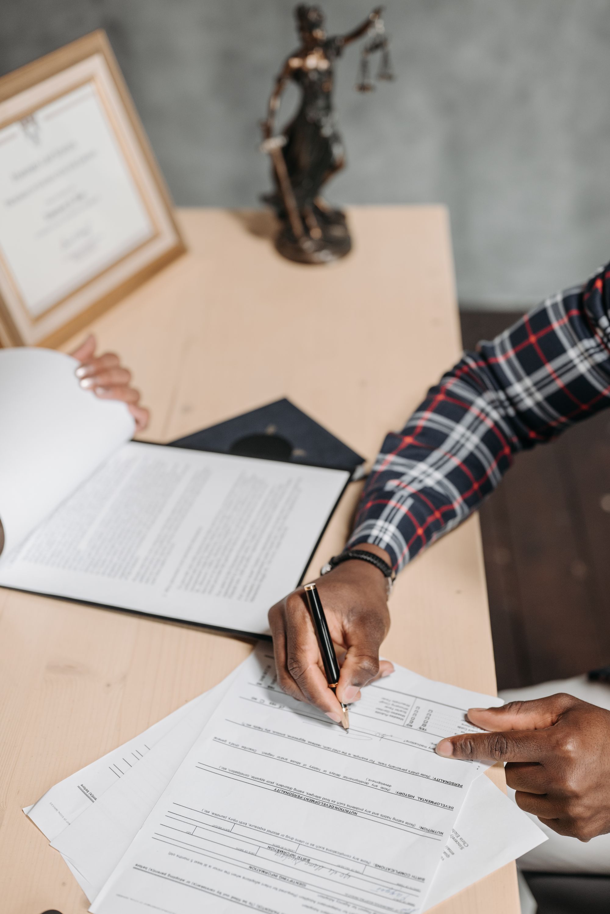 Signing an official document with a pen