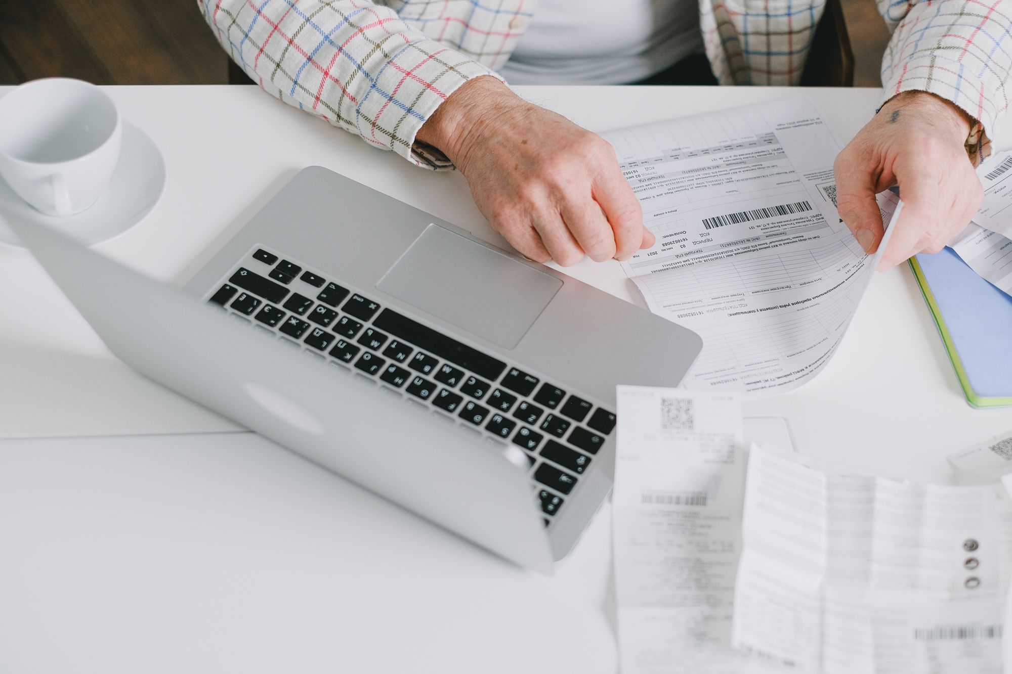 Reviewing invoices and paperwork at a desk