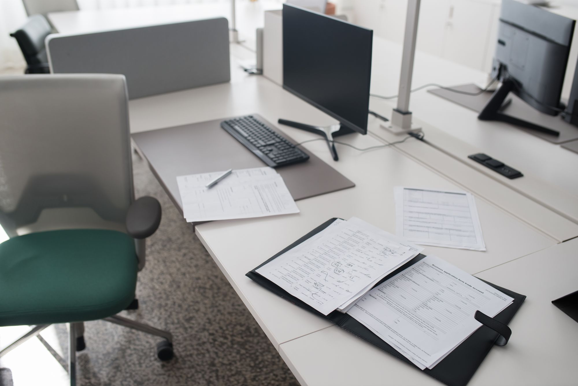 Modern office workspace with desks and monitors