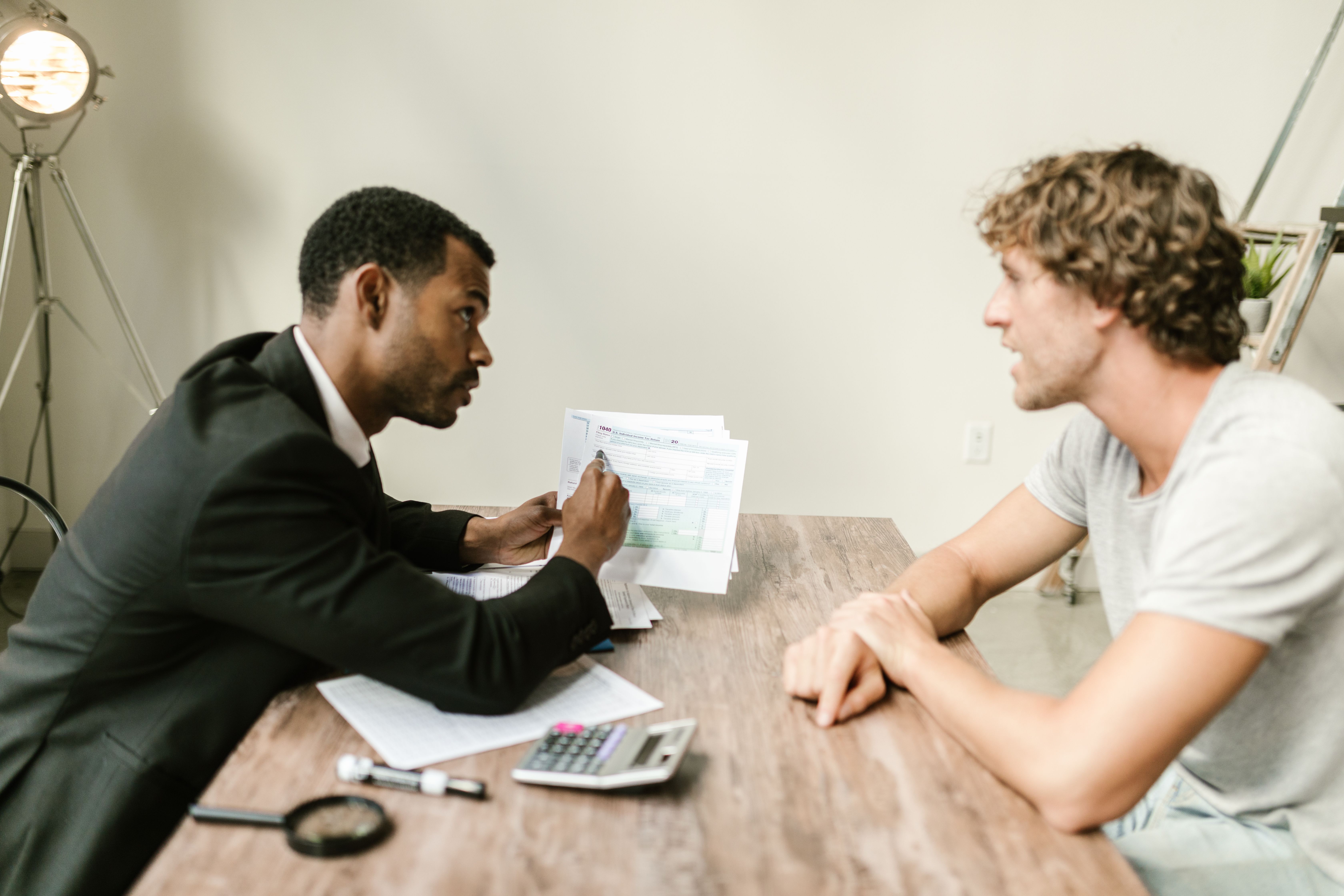 Accountant advising a client over tax paperwork