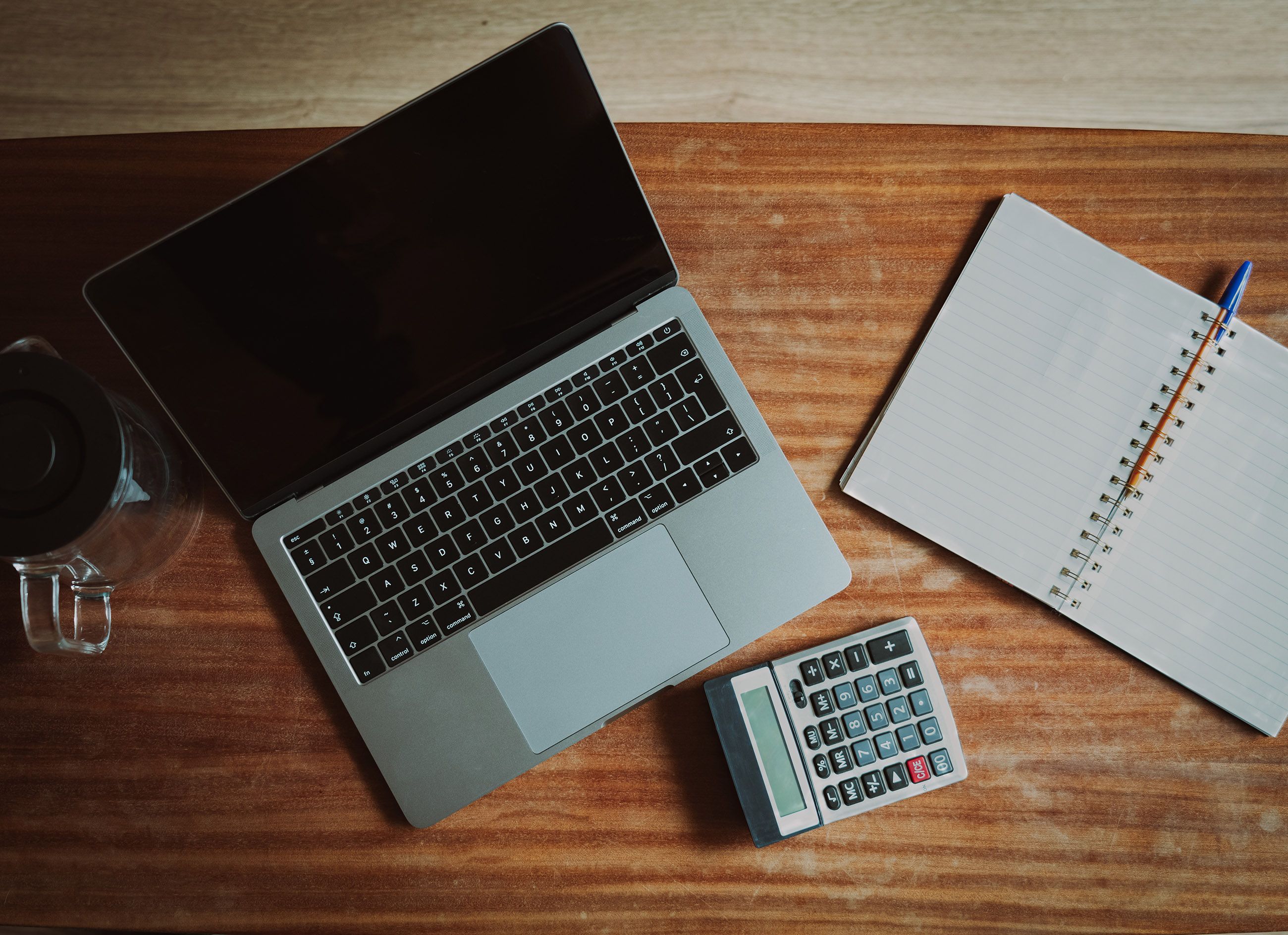 Laptop and calculator set up for payroll processing